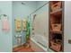 Bright bathroom with shower, tub, and built-in shelving for storage at 4520 Hedrick St., North Myrtle Beach, SC 29582
