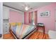 Bright bedroom with a colorful striped bedspread and unique built-in wardrobe for extra storage at 4520 Hedrick St., North Myrtle Beach, SC 29582