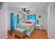 Bright bedroom with hardwood floors, ceiling fan, and coastal decor at 4520 Hedrick St., North Myrtle Beach, SC 29582