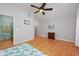 Spacious bedroom with hardwood floors and access to the ensuite bathroom at 4520 Hedrick St., North Myrtle Beach, SC 29582