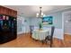 Cozy dining area with seating for two, hardwood floors, and coastal decor at 4520 Hedrick St., North Myrtle Beach, SC 29582