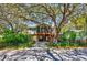 Beautiful home with large trees in the front yard and a screened porch at 4520 Hedrick St., North Myrtle Beach, SC 29582