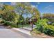Charming elevated home with lush landscaping, gated entrance, and scenic views from the upper level at 4520 Hedrick St., North Myrtle Beach, SC 29582