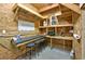 The garage offers a functional bar area with seating and ample overhead shelving for organized storage solutions at 4520 Hedrick St., North Myrtle Beach, SC 29582