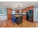 Modern kitchen with an island, stainless steel appliances, and ample cabinet space at 4520 Hedrick St., North Myrtle Beach, SC 29582
