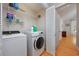 Laundry room with washer, dryer, and shelving for storage at 4520 Hedrick St., North Myrtle Beach, SC 29582