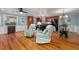 Open-concept living space with hardwood floors and modern lighting fixtures at 4520 Hedrick St., North Myrtle Beach, SC 29582