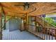 Spacious covered deck with stairs, outdoor shower, and seating, creating a relaxing outdoor retreat at 4520 Hedrick St., North Myrtle Beach, SC 29582