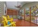 Inviting screened porch with charming yellow adirondack chairs, offering a relaxing outdoor space at 4520 Hedrick St., North Myrtle Beach, SC 29582