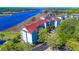Beautiful aerial view of waterfront condos featuring lush greenery, and waterway at 4560 Greenbriar Dr. # 306B, Little River, SC 29566