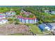 Aerial view showcasing multiple condo buildings surrounded by golf course and waterway at 4560 Greenbriar Dr. # 306B, Little River, SC 29566