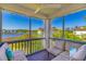 Screened balcony with comfortable seating and serene waterfront views at 4560 Greenbriar Dr. # 306B, Little River, SC 29566