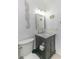 Cozy bathroom featuring shiplap walls and a stylish vanity with marble countertop at 4560 Greenbriar Dr. # 306B, Little River, SC 29566