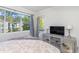 Bright bedroom with large windows and a view of the trees at 4560 Greenbriar Dr. # 306B, Little River, SC 29566