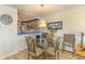 Dining room with views to kitchen, open floor plan and glass table at 4560 Greenbriar Dr. # 306B, Little River, SC 29566
