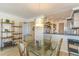 Dining room with chandelier and views to kitchen, with an open floor plan at 4560 Greenbriar Dr. # 306B, Little River, SC 29566