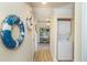 Hallway with washer and dryer, a decorative buoy, and beach-themed decor at 4560 Greenbriar Dr. # 306B, Little River, SC 29566