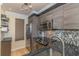 Modern kitchen featuring wooden cabinets, stainless steel appliances, and granite countertop at 4560 Greenbriar Dr. # 306B, Little River, SC 29566