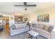 Inviting living room with two sofas, ceiling fan and view to the kitchen and dining area at 4560 Greenbriar Dr. # 306B, Little River, SC 29566