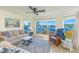 This is a living room with a view overlooking the river or lake at 4560 Greenbriar Dr. # 306B, Little River, SC 29566