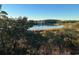 Picturesque view of the inter-coastal waterway with marsh grasses and community in background at 4560 Greenbriar Dr. # 306B, Little River, SC 29566