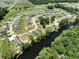 Aerial view of a riverfront community featuring beautiful landscaping and waterfront access at 476 Honeyhill Loop, Conway, SC 29526