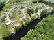 Aerial view of a riverfront community featuring beautiful landscaping and waterfront access at 476 Honeyhill Loop, Conway, SC 29526