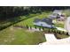 Aerial view of a well-maintained backyard with new construction home and stream at 476 Honeyhill Loop, Conway, SC 29526