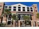 View of the Biggs Veterans Plaza entrance with black iron gates and palm trees at 476 Honeyhill Loop, Conway, SC 29526