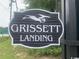 Close-up of the Grissett Landing community sign with green foliage at 476 Honeyhill Loop, Conway, SC 29526