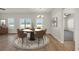Bright and spacious dining area with seating for six and large windows at 476 Honeyhill Loop, Conway, SC 29526