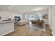 Open-concept living and dining area with hardwood floors and modern furnishings at 476 Honeyhill Loop, Conway, SC 29526