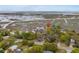 An aerial shot showcases the serene marsh views and the community at 4999 Highway 17 Business # 302, Murrells Inlet, SC 29576