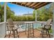 Balcony overlooking the community pool, featuring outdoor seating and tranquil scenery at 4999 Highway 17 Business # 302, Murrells Inlet, SC 29576
