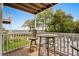 Covered balcony with a marsh view featuring a dining table and comfortable seating at 4999 Highway 17 Business # 302, Murrells Inlet, SC 29576