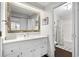 Bathroom featuring white vanity with a framed mirror and access to the shower and toilet at 4999 Highway 17 Business # 302, Murrells Inlet, SC 29576