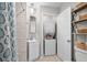 Cozy bathroom featuring a sink, a stacked washer/dryer unit, and storage shelves at 4999 Highway 17 Business # 302, Murrells Inlet, SC 29576
