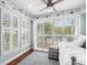 Bright bedroom with white trundle bed, ceiling fan, and plantation shutters at 4999 Highway 17 Business # 302, Murrells Inlet, SC 29576
