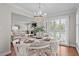 Cozy dining room with a charming chandelier, plantation shutters, and stylish decor at 4999 Highway 17 Business # 302, Murrells Inlet, SC 29576