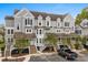 Well-maintained condo with gray siding, charming shutters, and inviting staircases leading to each entrance at 4999 Highway 17 Business # 302, Murrells Inlet, SC 29576