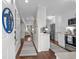 Bright and welcoming foyer with hardwood floors, leading to the kitchen and living areas at 4999 Highway 17 Business # 302, Murrells Inlet, SC 29576