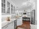 Bright kitchen featuring white cabinets, stainless appliances, and seamless flow into the living area at 4999 Highway 17 Business # 302, Murrells Inlet, SC 29576