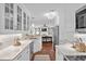 Bright kitchen featuring white cabinets, stainless appliances, and seamless flow into the living area at 4999 Highway 17 Business # 302, Murrells Inlet, SC 29576
