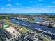 Aerial view of a harbor with yachts, townhouses, swimming pools, and a coastal setting at 5750 Oyster Catcher Dr. # 714, North Myrtle Beach, SC 29582