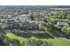 Aerial view of a residential community surrounded by lush greenery, mature trees, and a golf course at 5750 Oyster Catcher Dr. # 714, North Myrtle Beach, SC 29582