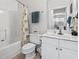 Bright bathroom featuring a tub with shower, white vanity, and a well-lit mirror at 5750 Oyster Catcher Dr. # 714, North Myrtle Beach, SC 29582