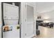 Convenient laundry area featuring a stacked washer and dryer unit with adjacent storage at 5750 Oyster Catcher Dr. # 714, North Myrtle Beach, SC 29582