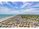 Overhead view of beachfront recreational vehicle park and surrounding trees, ocean and beach at 5905 S Kings Hwy. # 1612, Myrtle Beach, SC 29575