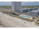 Aerial view of the community's beach access with pools and manicured landscaping at 5905 S Kings Hwy. # 1612, Myrtle Beach, SC 29575