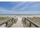 Wooden boardwalk over grassy dunes provides easy access to the beautiful sandy beach at 5905 S Kings Hwy. # 1612, Myrtle Beach, SC 29575